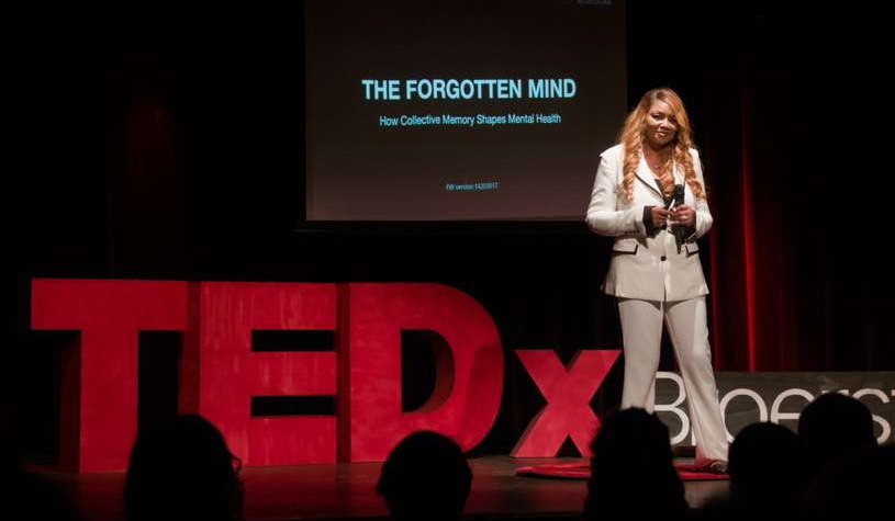 Malaysia Harrell speaking on the TedX Broerstraat stage