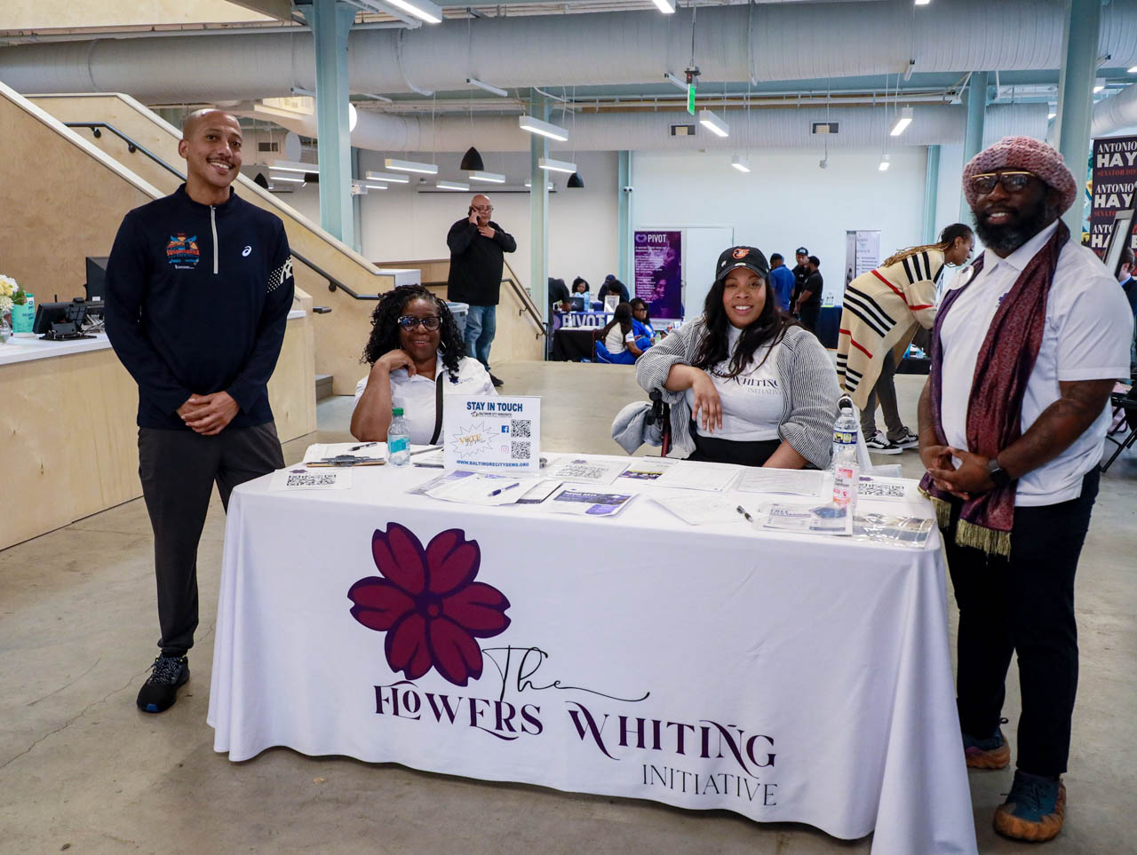 UMB SSW Student and The founder of the Flowers Whiting Initiative Derrick Whiting taking a photograph with Councilman John Bullock