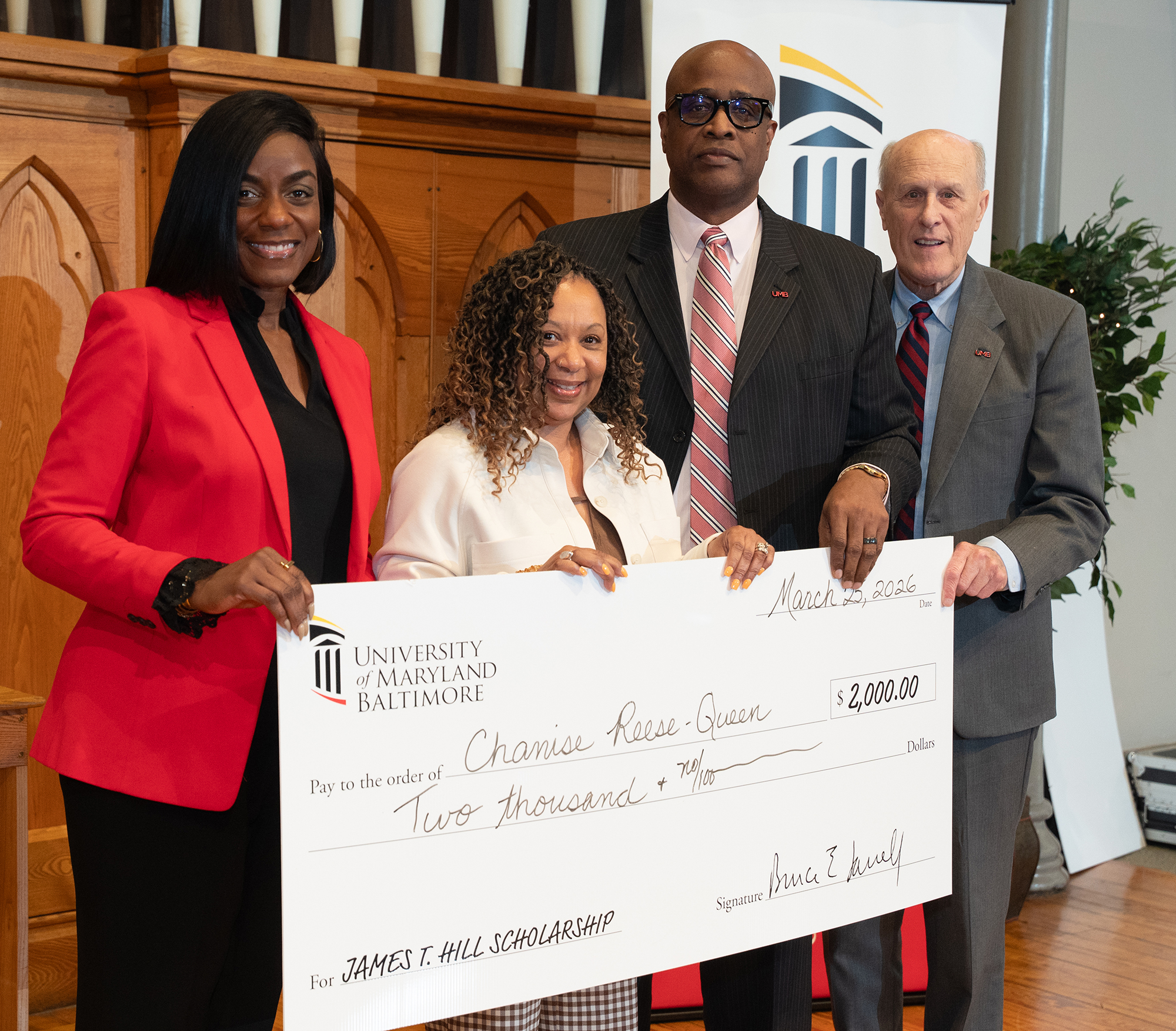 Chanise Reese-Queen, second from left, stands with, from left, Malika Monger, Roger Ward, and Bruce Jarrell