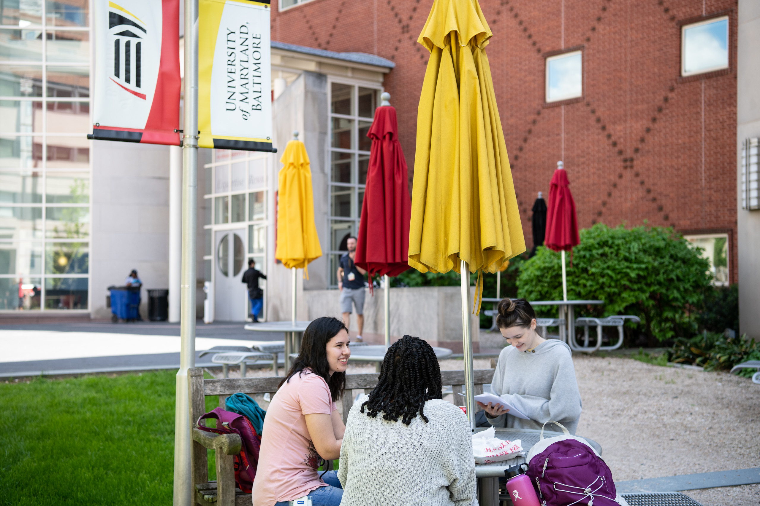 students sitting outside at a table