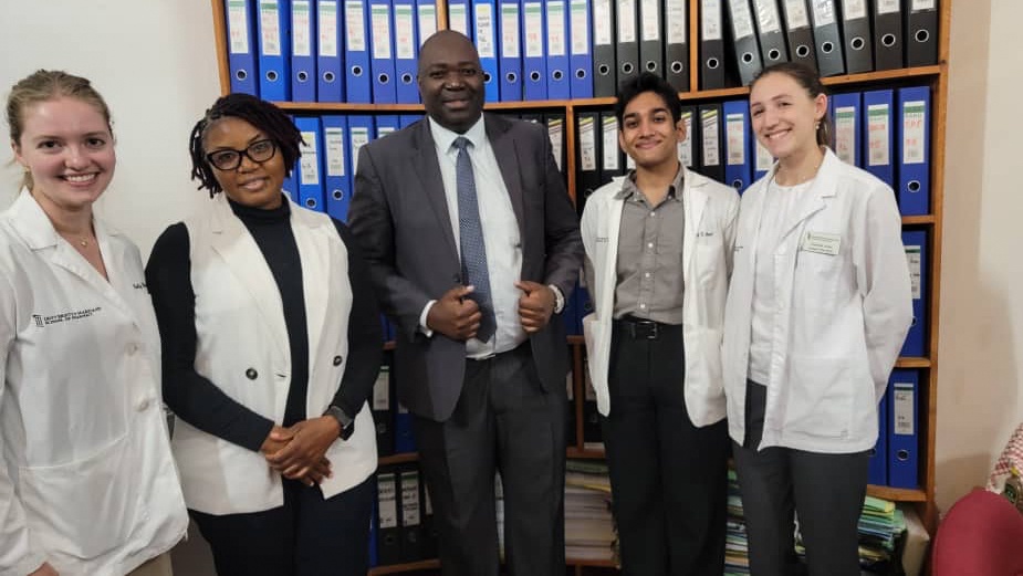 Left to right, student Holly Verbrugge, professor Audrey Hamachila, professor Sody Munsaka, student Vraj Patel, and student Christine Rojas during the UMSOP students’ PharmD rotation in Zambia.