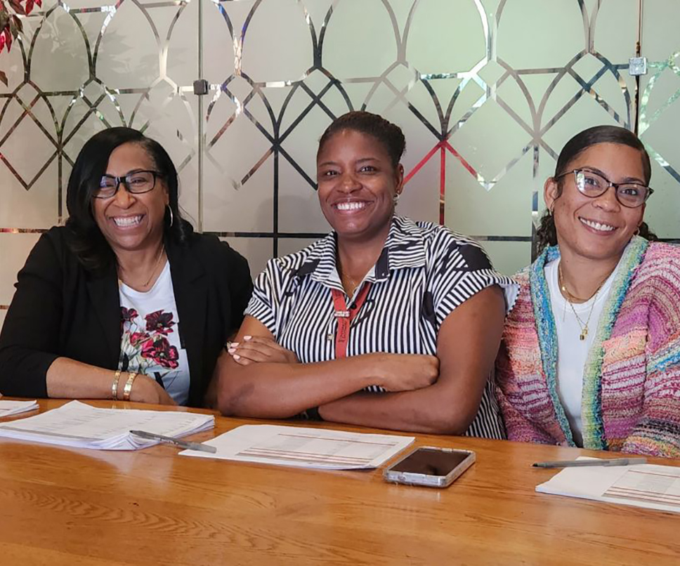 Lisa Crawley, Danielle Hill, and Bianca Thornley greet guests as they arrive