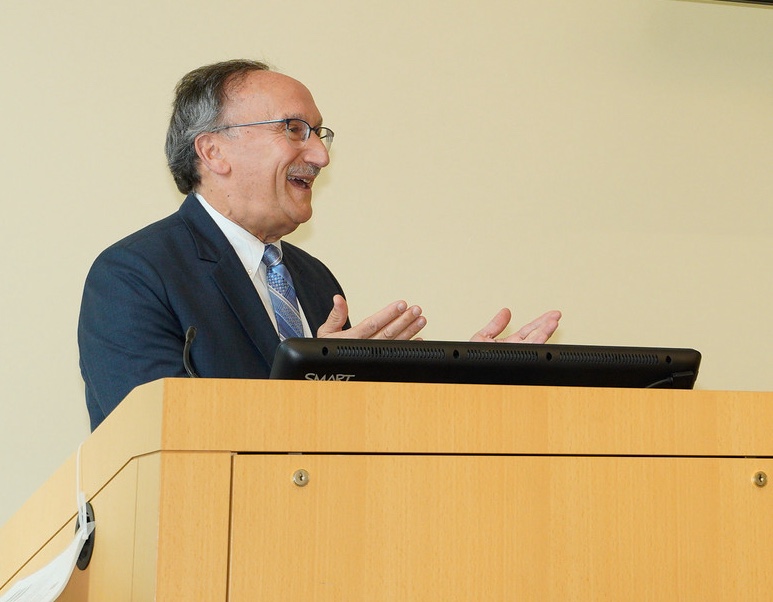 Harv Feldman speaks at a podium  