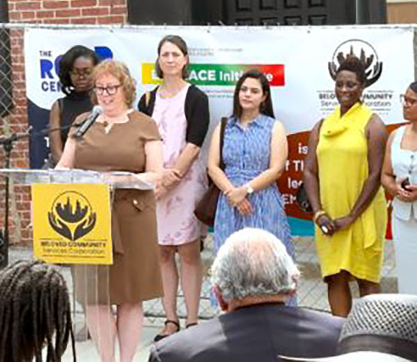 Lydia Watts, executive director of ROAR, speaks at the dedication of the center's new offices in West Baltimore.