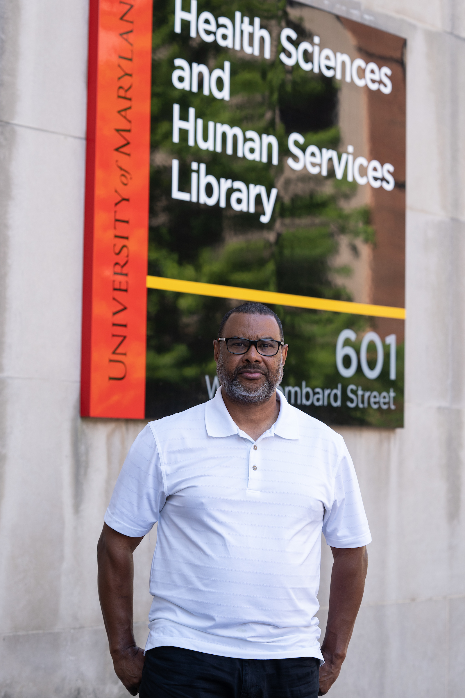 Patrick Williams standing outside the Health Sciences and Human Services Library