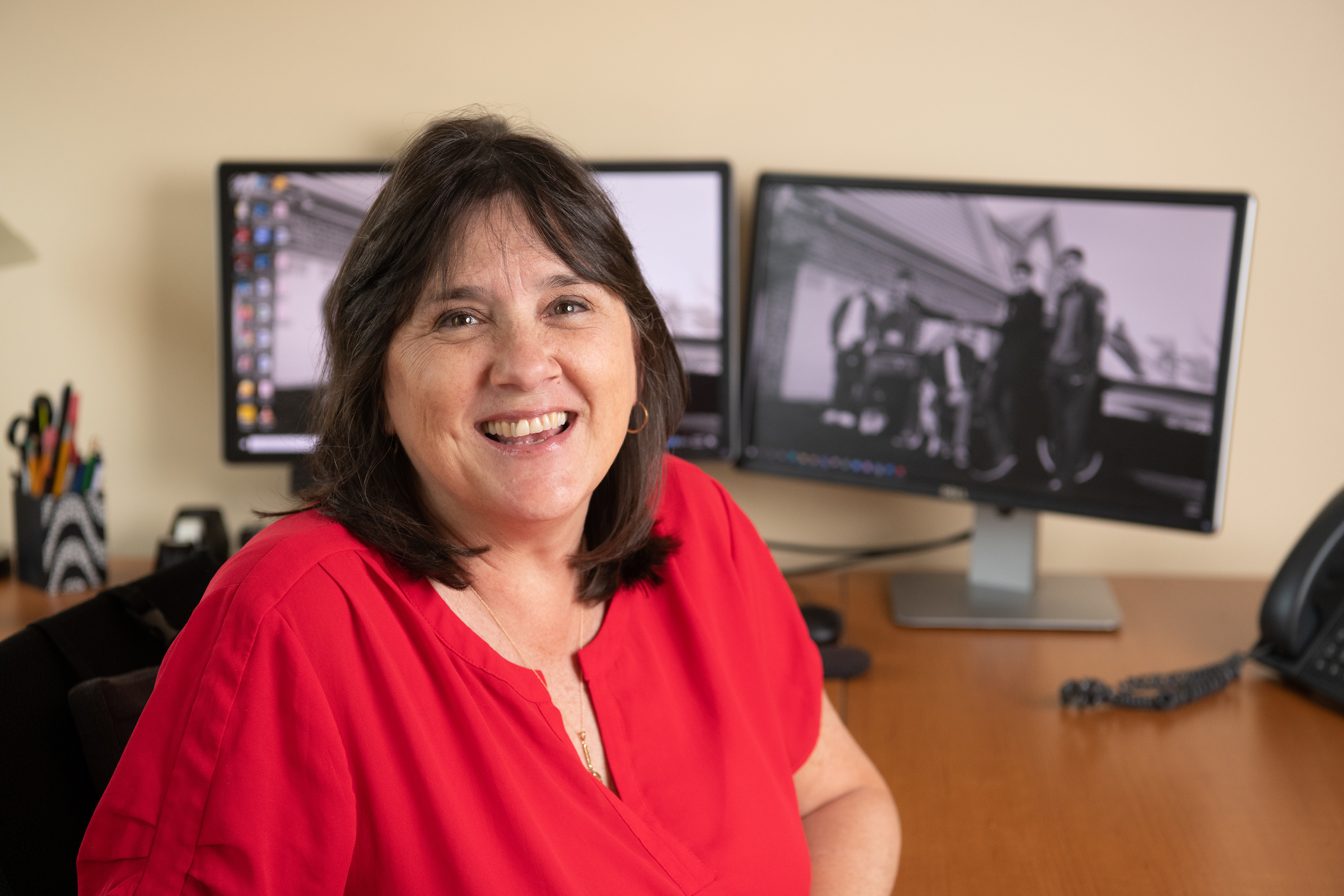 Elisa Medina at her desk