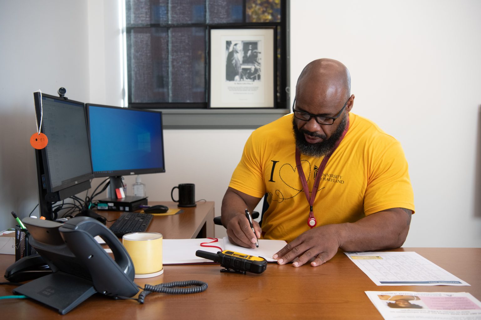 Tyrone Roper sits at his desk