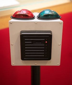 Pedestal has red and green lights on top and OneCard reader in front
