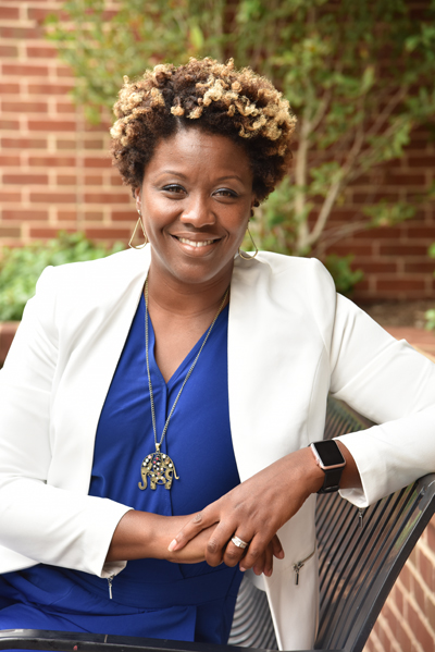 Cherita Adams standing in front of University of Maryland, Baltimore building