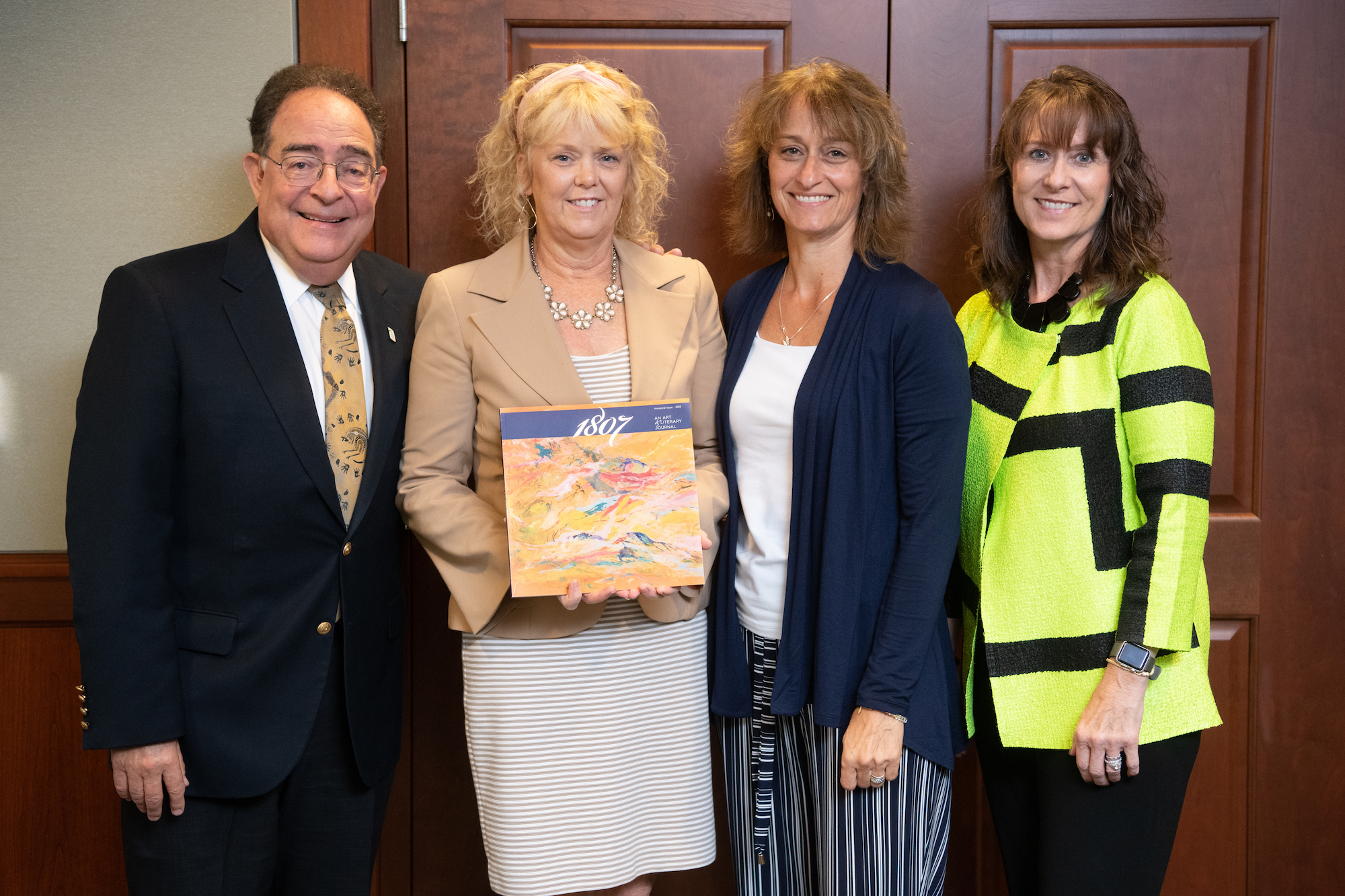 Photo of Rampolla, alongside President Perman, Kozak, and Litchman.