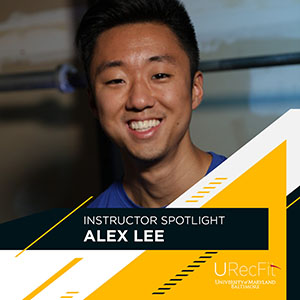 Alex Lee smiling with a black yellow and white stripe design on the bottom right with URecFit logo and the word 