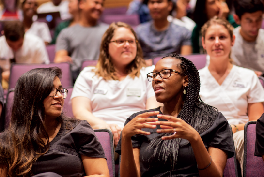 students from two disciplines sit together