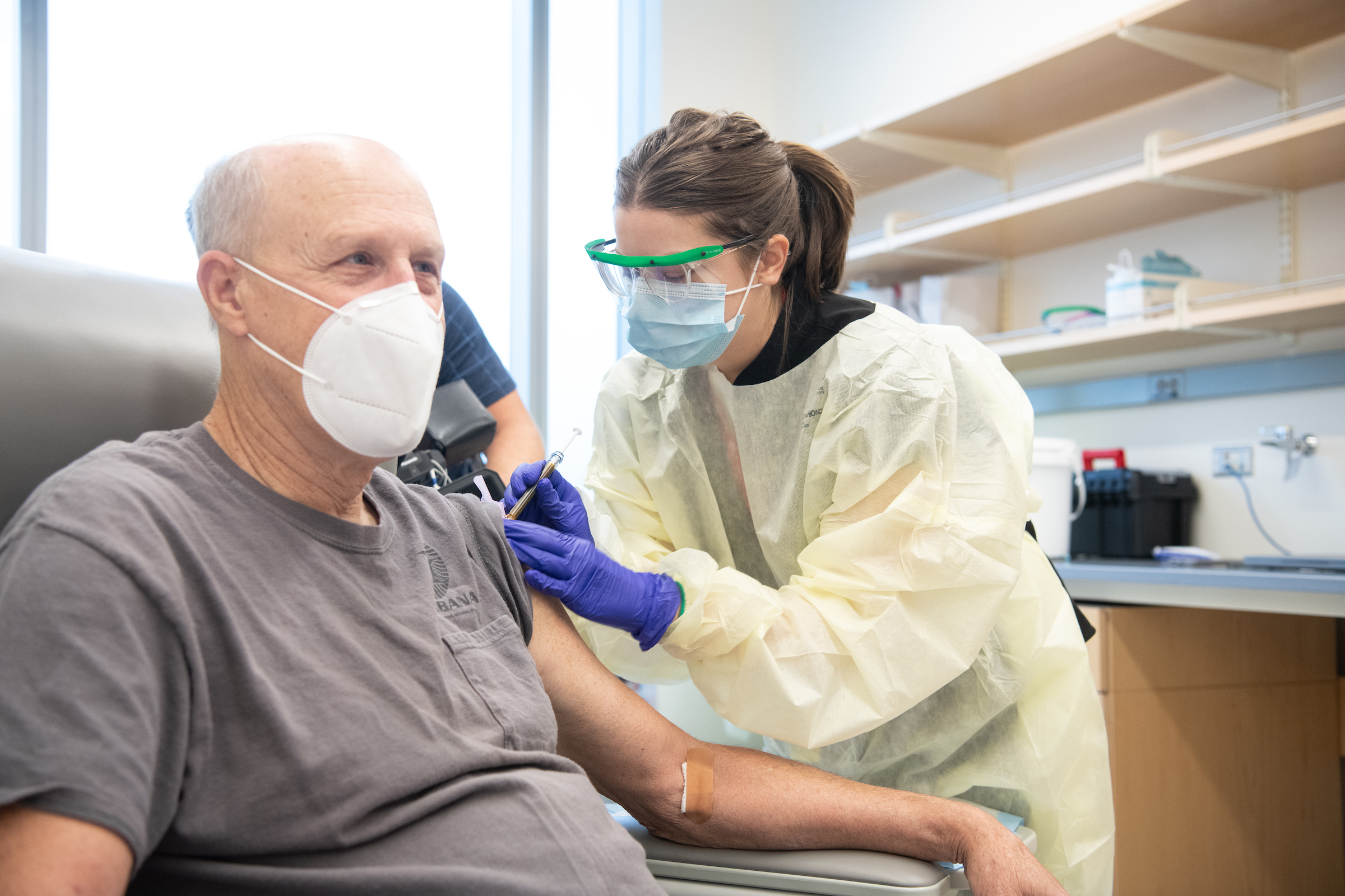 UMB President Bruce E. Jarrell gets a shot in the CVD's Phase 3 trial