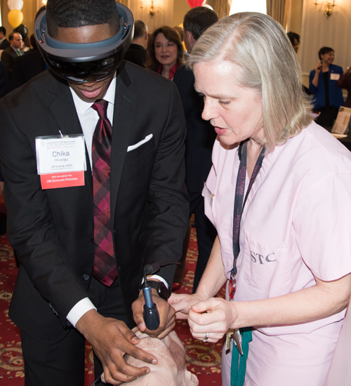 University of Maryland School of Nursing student Chika Okusogu, also a UM Scholar, participates in a demonstration conducted by Sarah B. Murthi, MD, associate professor at the UM School of Medicine