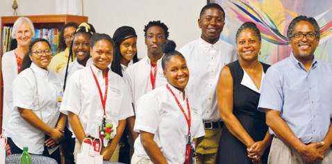 Trocky (far left) with P-TECH students, in white shirts, and other University of Maryland, Baltimore employees during the students’ visit to UMSON in 2019.