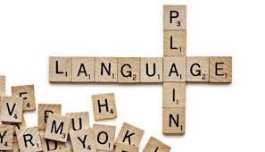 Scrabble pieces spelling out Plain Language