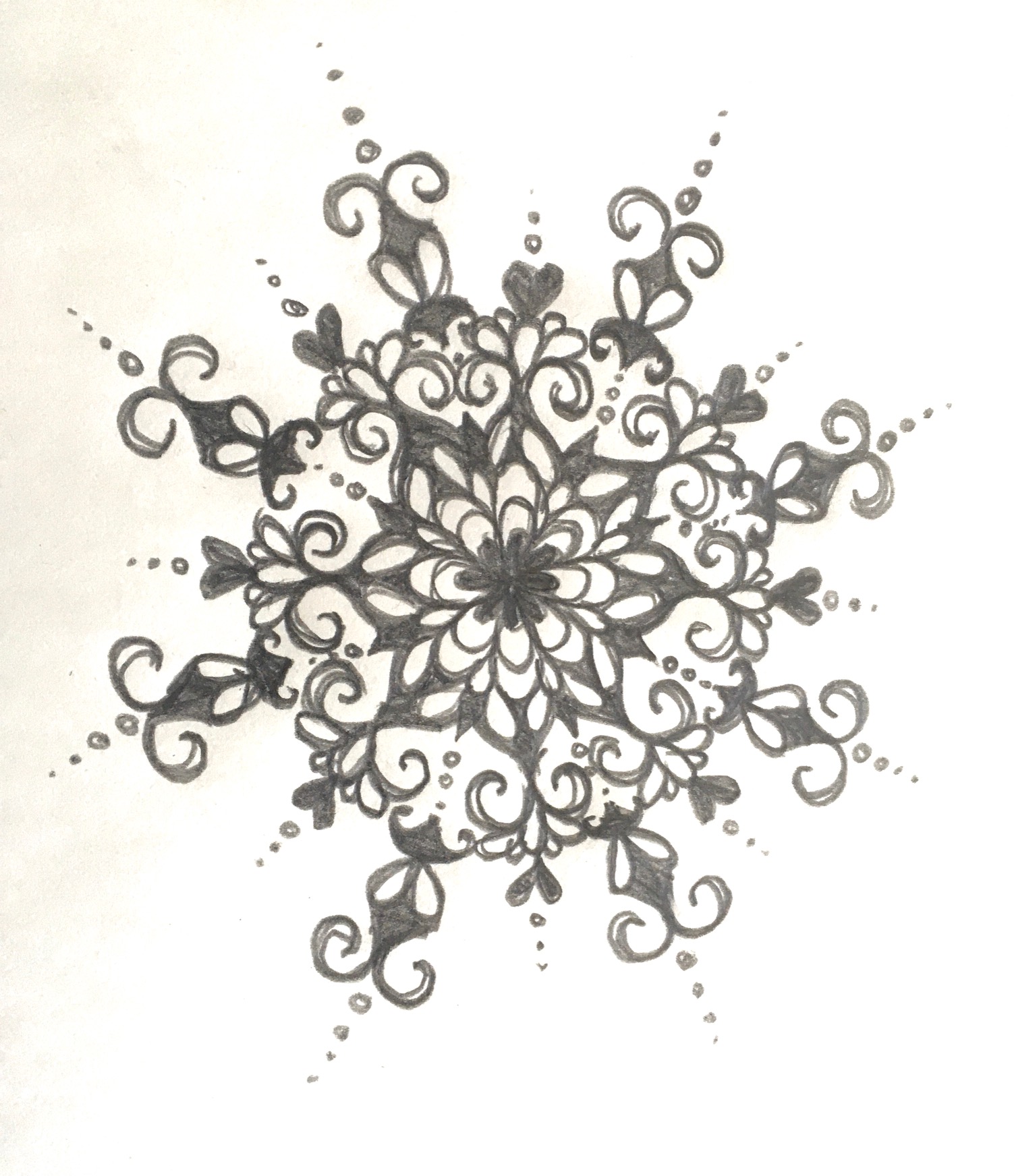 Pencil drawing called a mandala, a circle design that resembles a snowflake.