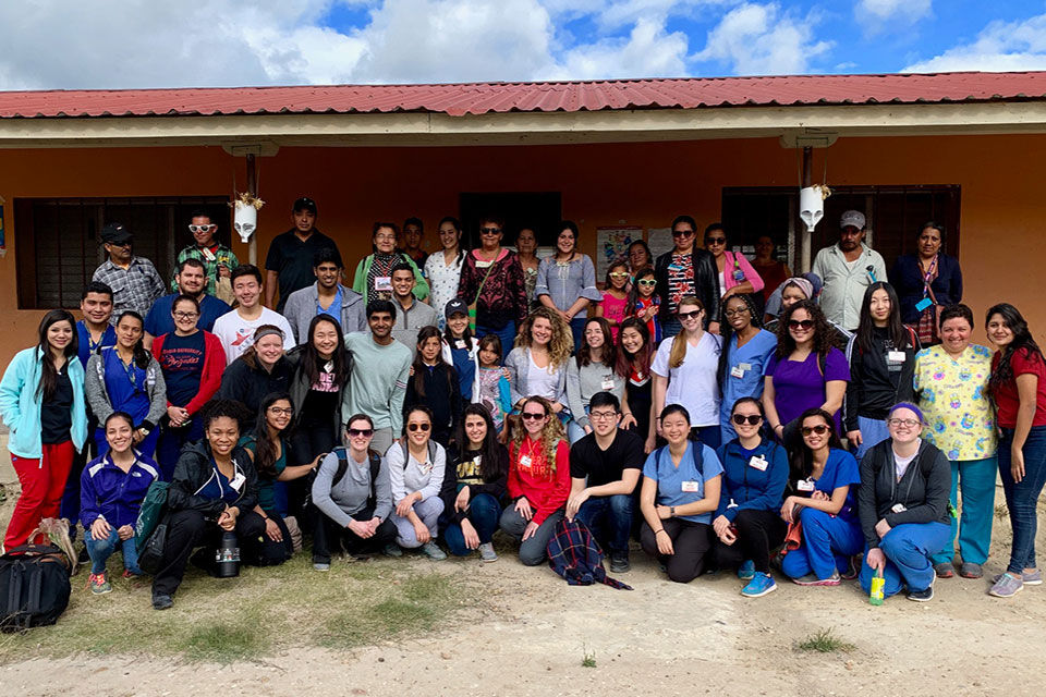 Students and health care providers pose for photo during Global Medical Brigades recent visit to Honduras.