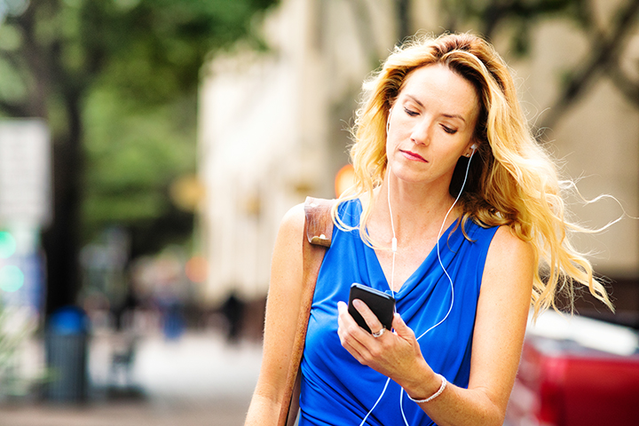 woman walking with headphones