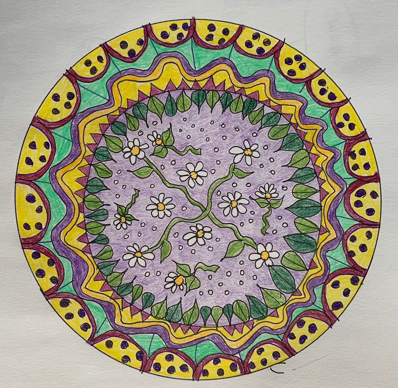 circular mandala design with flowers, colored using shades of green, purple and yellow
