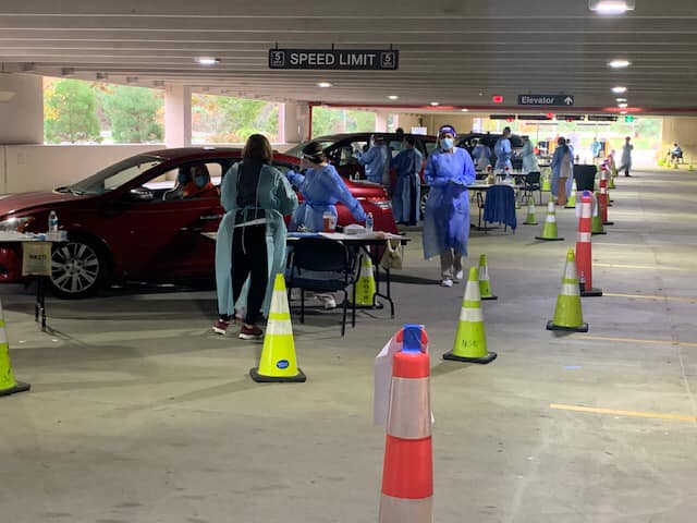 Nursing faculty and students staff drive-through flu clinic (photo credit: Steve Simon)