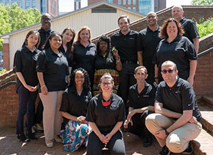 Image of PATIENTS Program Team with School of Pharmacy Building in the background