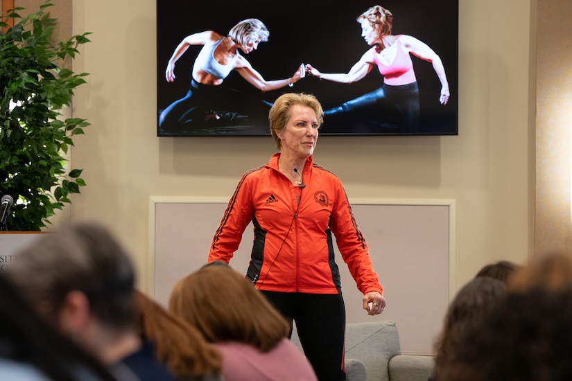 Pamela Peeke speaks with a photo of herself posing 40 years ago and recently