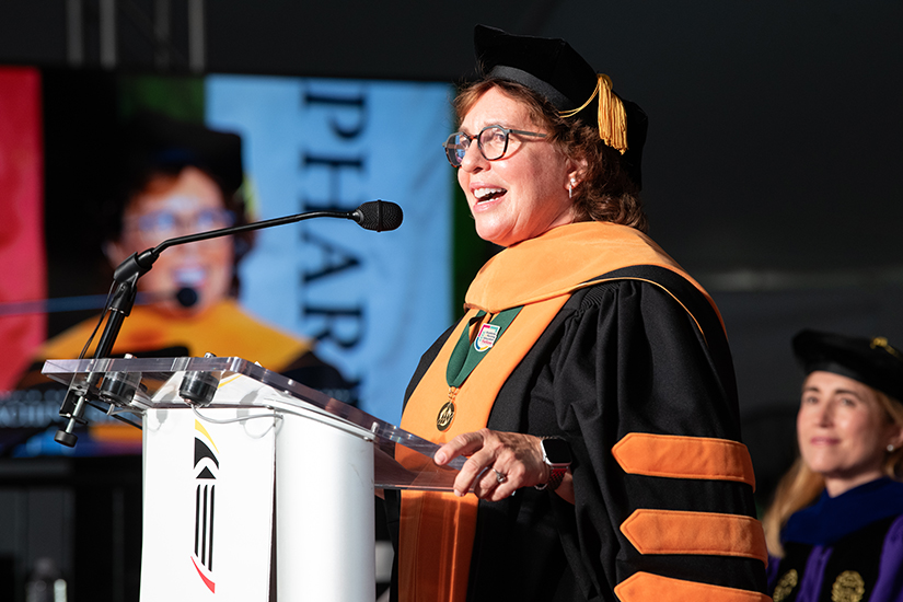 Susan Bindon delivers her speech at UMB's Faculty Convocation
