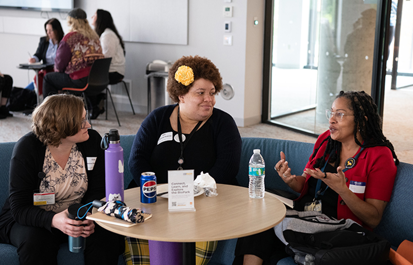 Attendees chat during the Values in Action Speaker Series event