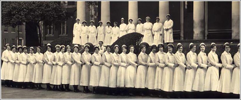 The School of Nursing’s Class of 1927 is shown along with 12 faculty members in front of Davidge Hall in a photo taken in late spring 1927.