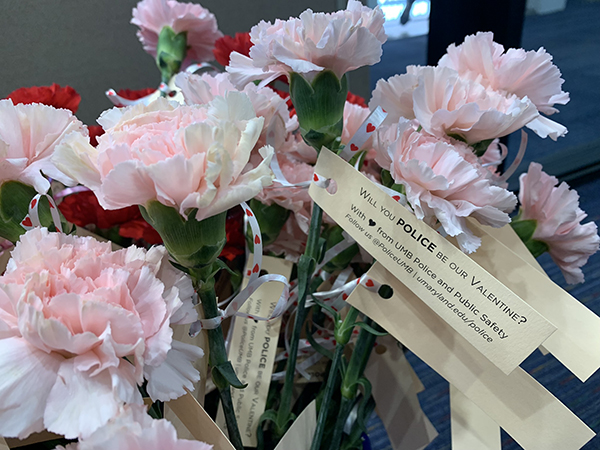 Carnations with a tag saying 