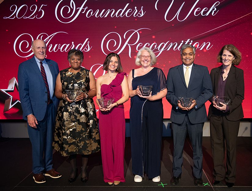 From left, UMB President Bruce Jarrell with Andrea Morgan, Danielle Basdekis, Kyla Liggett-Creel, Rajabrata Sarkar, and Kirsten Lyke
