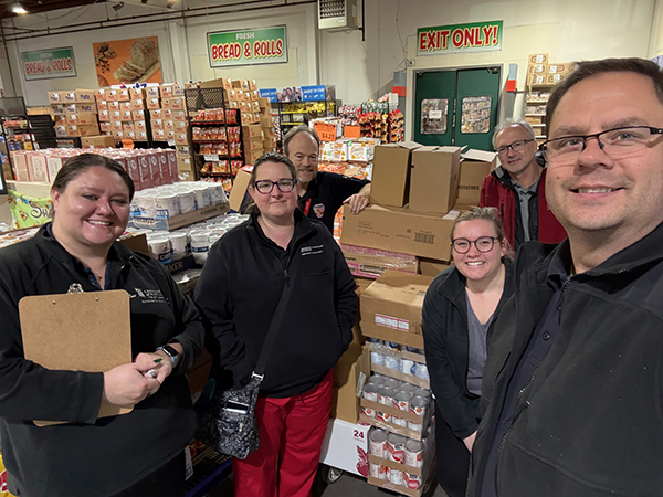 UMB employees who are working to keep the Employee Pantry shelves stocked.