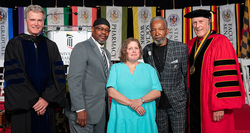 UMB Provost Mark Reynolds, far left, and President Bruce Jarrell, far right, stand with two members of the Unger Group and Rebecca Bowman-Rivas, center, of the Francis King Carey School of Law.