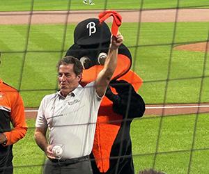 Dean Mark Gladwin with the Oriole bird on September 2024 at Oriole Park