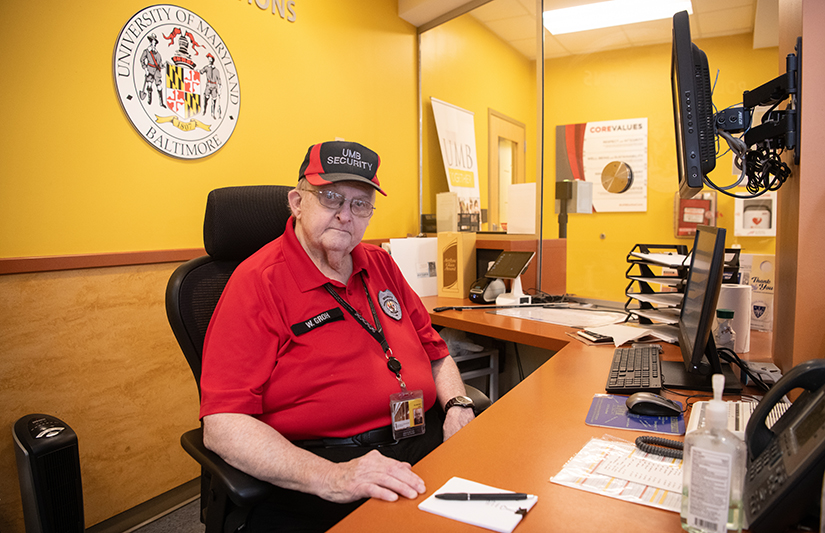 William Groh mans the front desk at UMB Police and Public Safety’s Pine Street Annex.