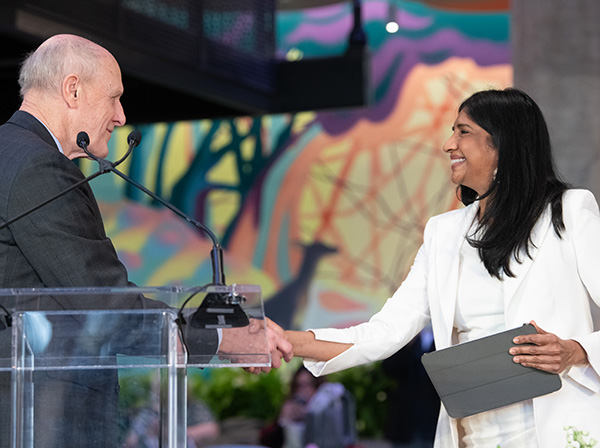 Bruce Jarrell greets Aruna Miller