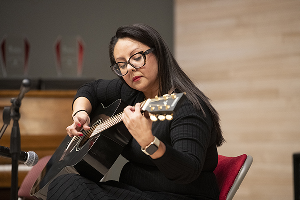 Woman playing guitar