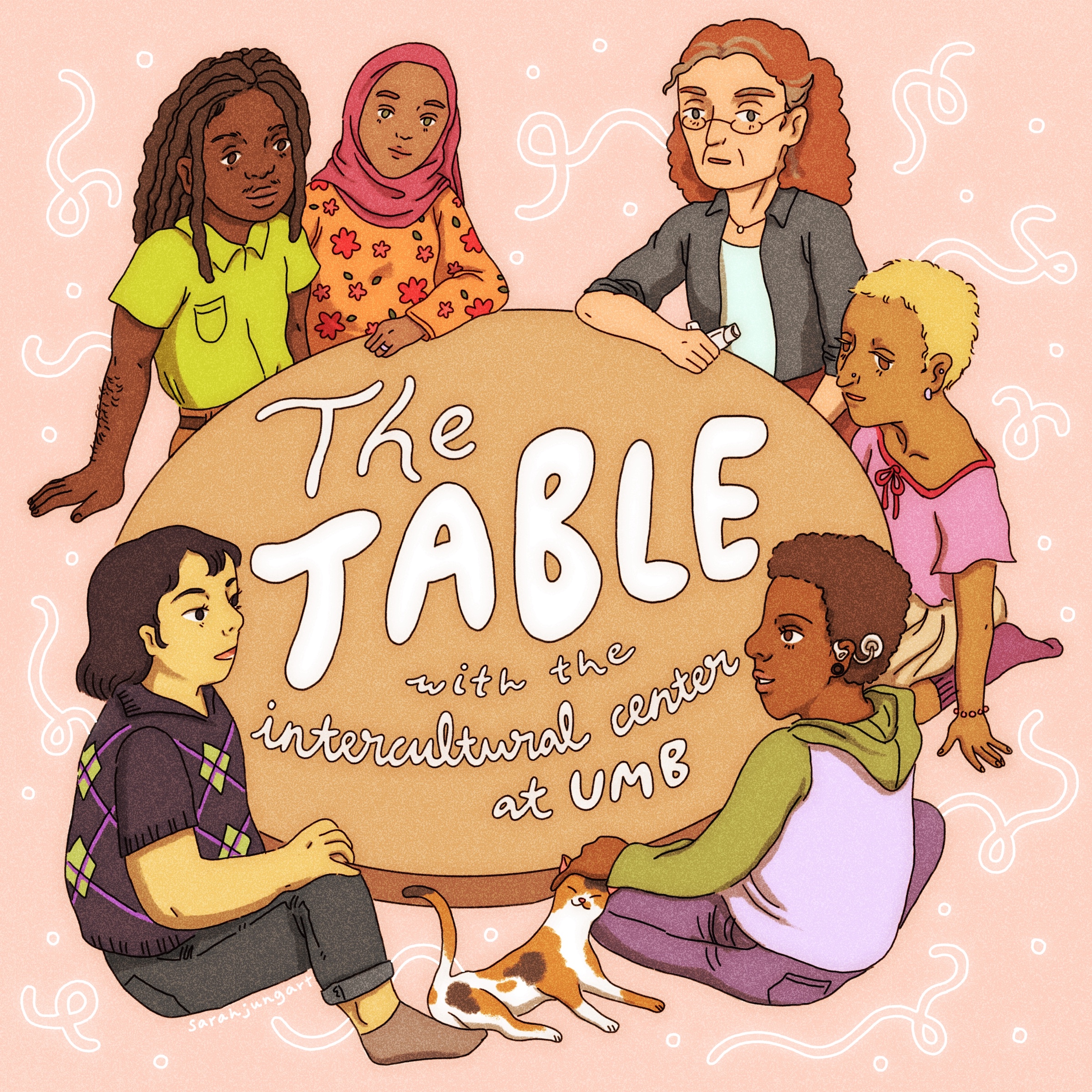 Six individuals of various social identities such as race, ability, age, and religion, sit around a table that has the words The Table with the Intercultural Center at UMB written in the middle.